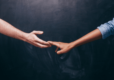 Partners reaching for each other